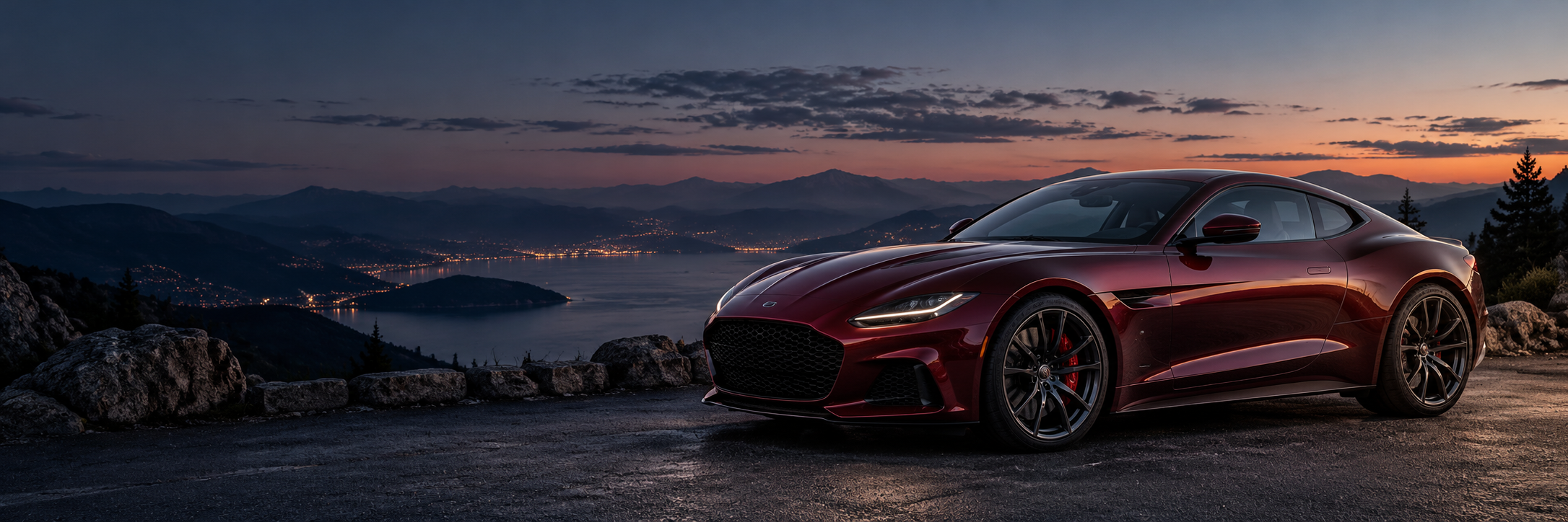 Burgundy sports coupe at a mountain overlook